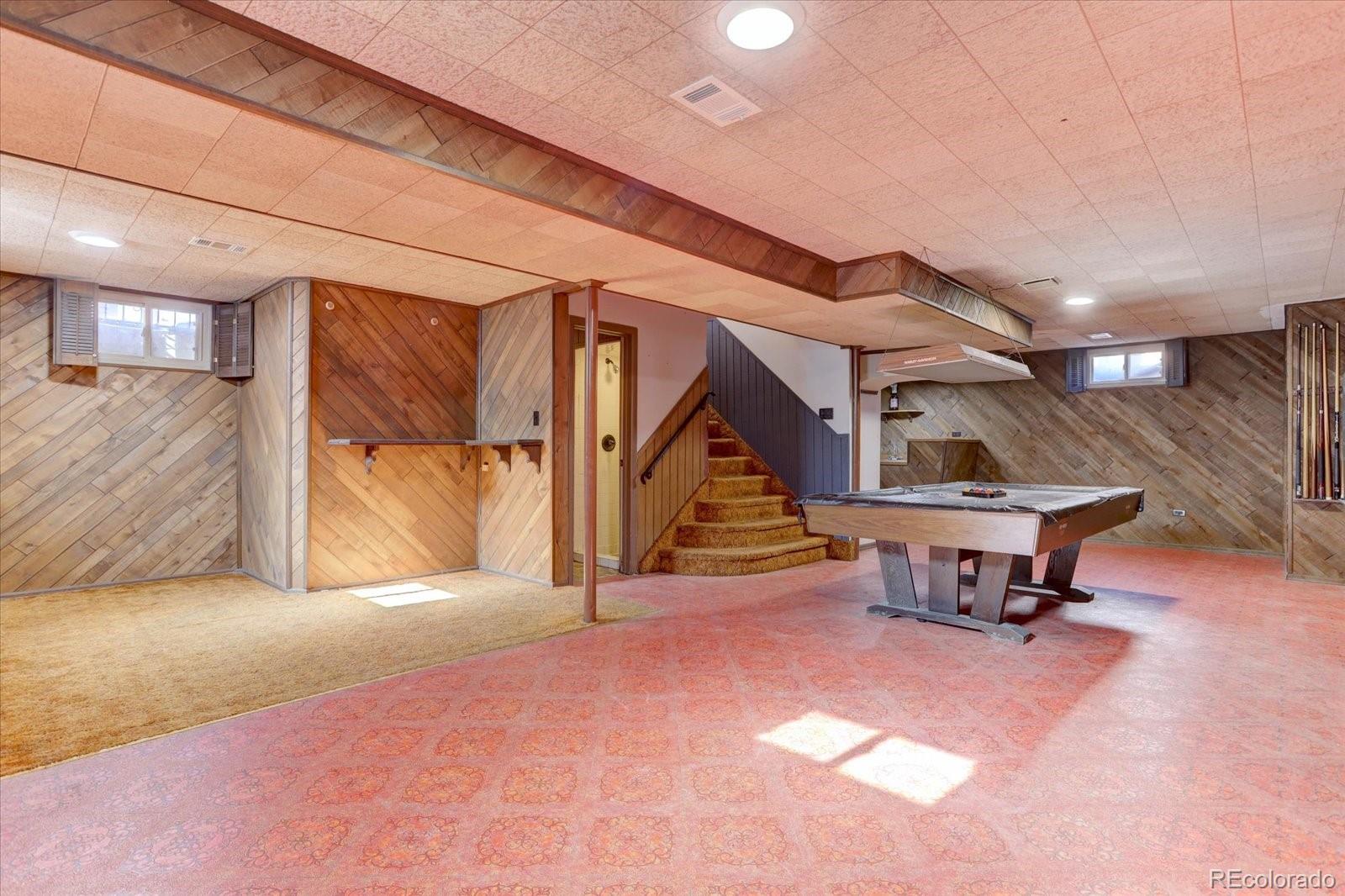 7141 Raritan Street Denver, CO 80221 - Photo 15 of 29 a view of an empty room with wooden floor