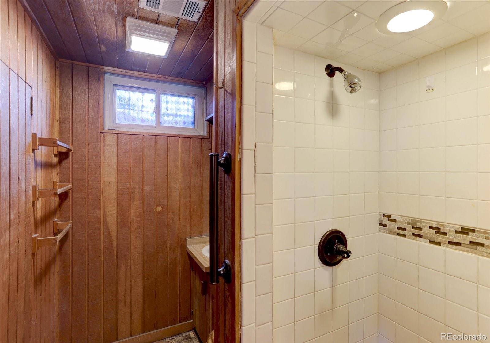 7141 Raritan Street Denver, CO 80221 - Photo 20 of 29 a bathroom with a shower