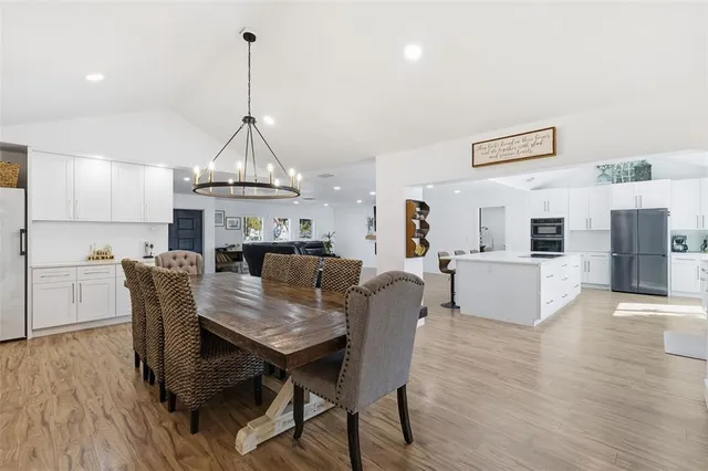 a bathroom with double vanity sink and a mirror