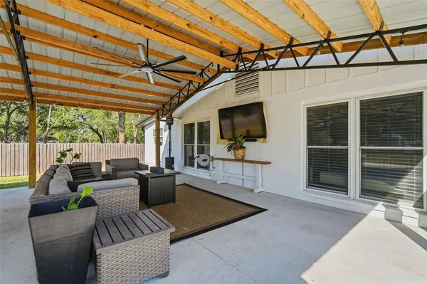 an aerial view of a house with a swimming pool