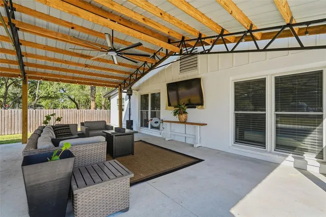 an aerial view of a house with a swimming pool