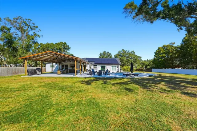 an aerial view of house with yard