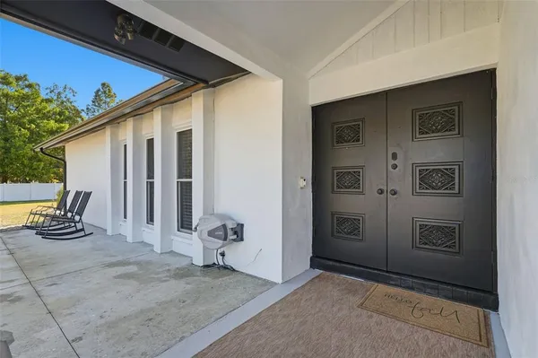 a spacious bathroom with a sink and a mirror