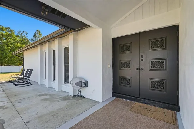 a spacious bathroom with a sink and a mirror
