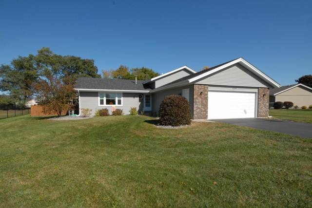 4154 Gloucester Road Roscoe, IL 61073 - Photo 1 of 22 a front view of a house with a garden and yard