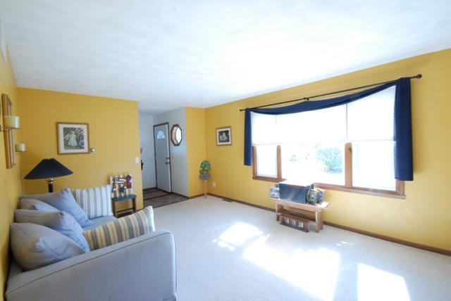 4154 Gloucester Road Roscoe, IL 61073 - Photo 3 of 22 a living room with furniture and a window