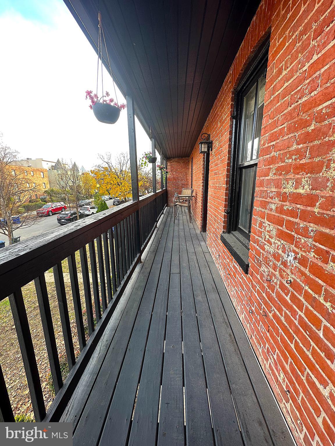 1133 D Street Northeast, Unit 2A Washington, DC 20002 - Photo 13 of 14 a view of balcony with wooden floor
