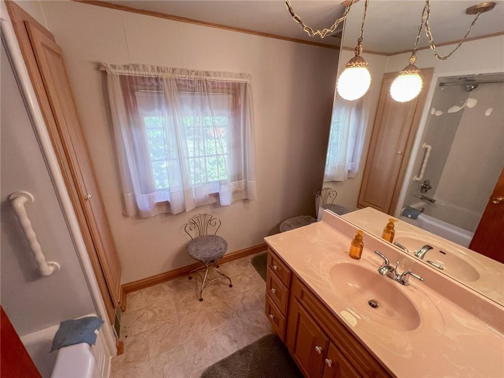 201 Beech Road Butler, PA 16001 - Photo 11 of 49 a bathroom with a tub sink and mirror