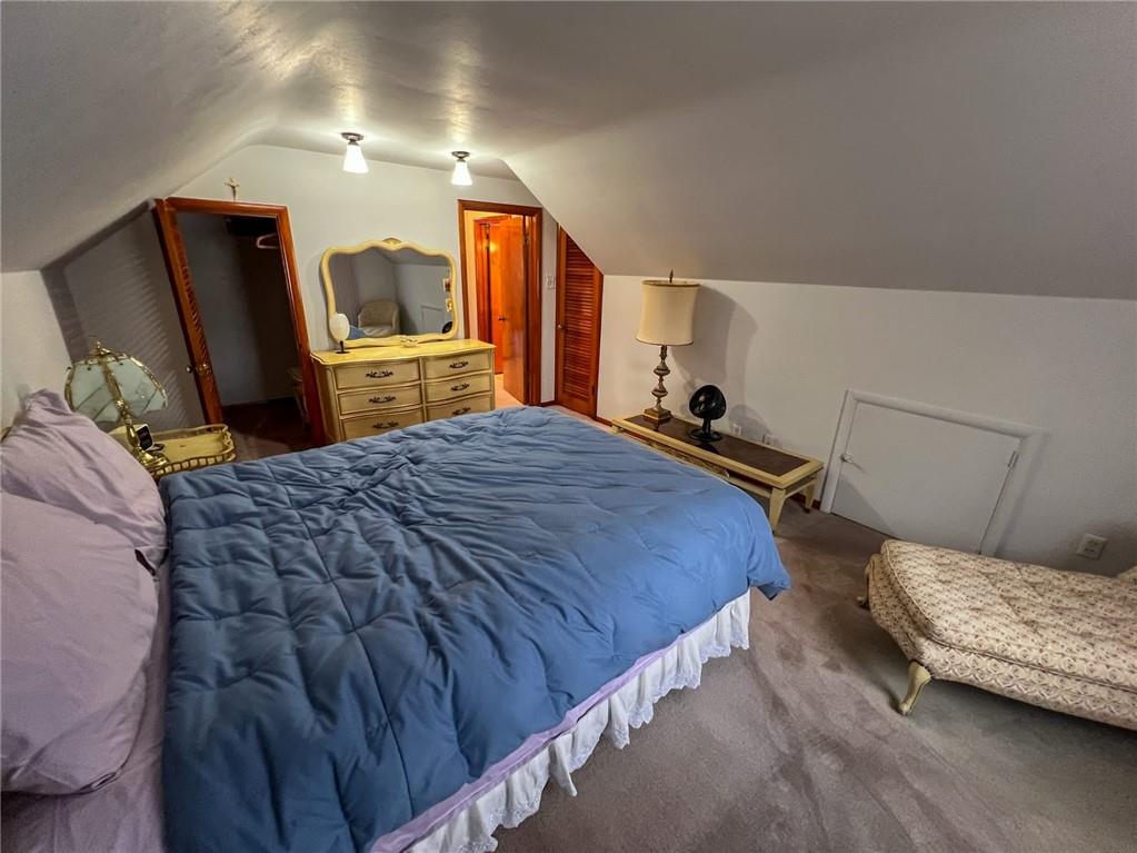 201 Beech Road Butler, PA 16001 - Photo 16 of 49 a bedroom with a bed a mirror on dresser and a wooden floor