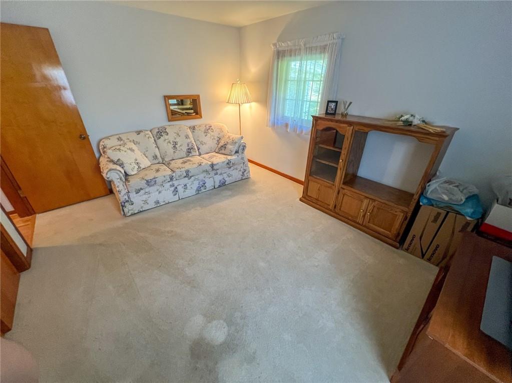 201 Beech Road Butler, PA 16001 - Photo 22 of 49 a bedroom with a bed and a couch