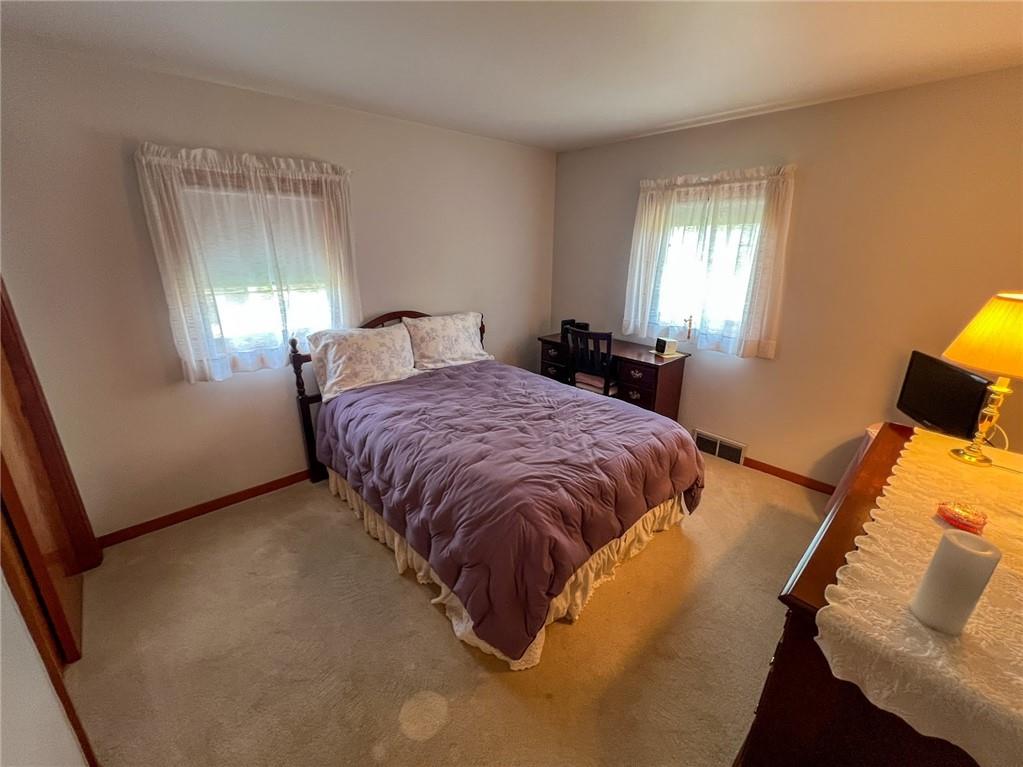 201 Beech Road Butler, PA 16001 - Photo 23 of 49 a bed sitting in a bedroom next to a window