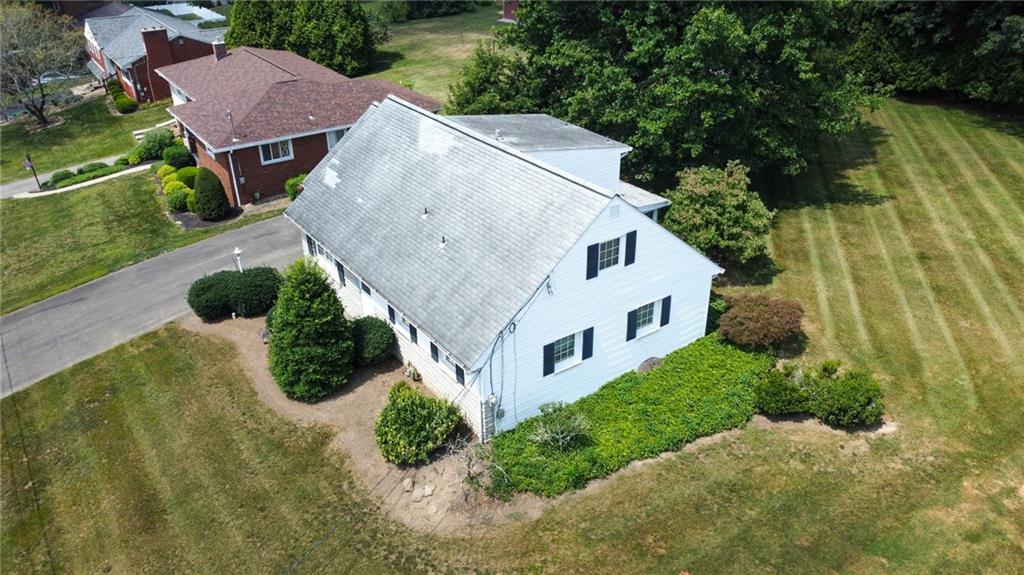 201 Beech Road Butler, PA 16001 - Photo 4 of 49 an aerial view of house with yard and trees in the background