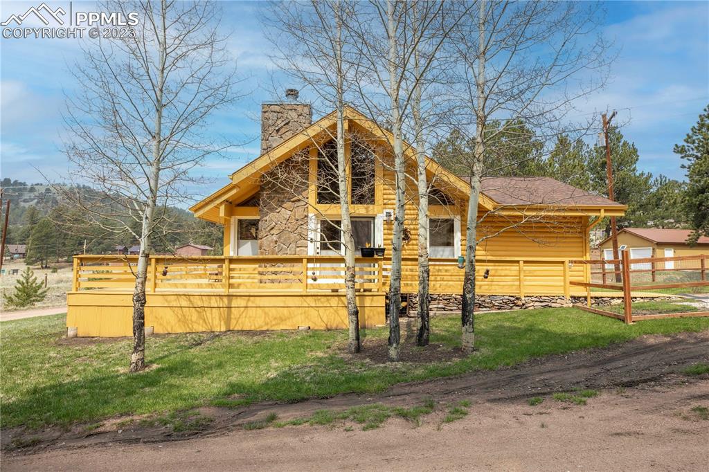 93 Water Street Guffey, CO 80820 - Photo 1 of 23 a view of a house with a yard