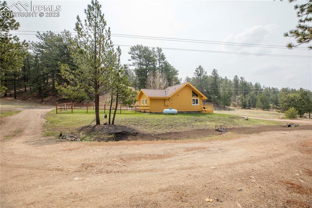 93 Water Street Guffey, CO 80820 - Photo 16 of 23 a view of yard with wooden fence
