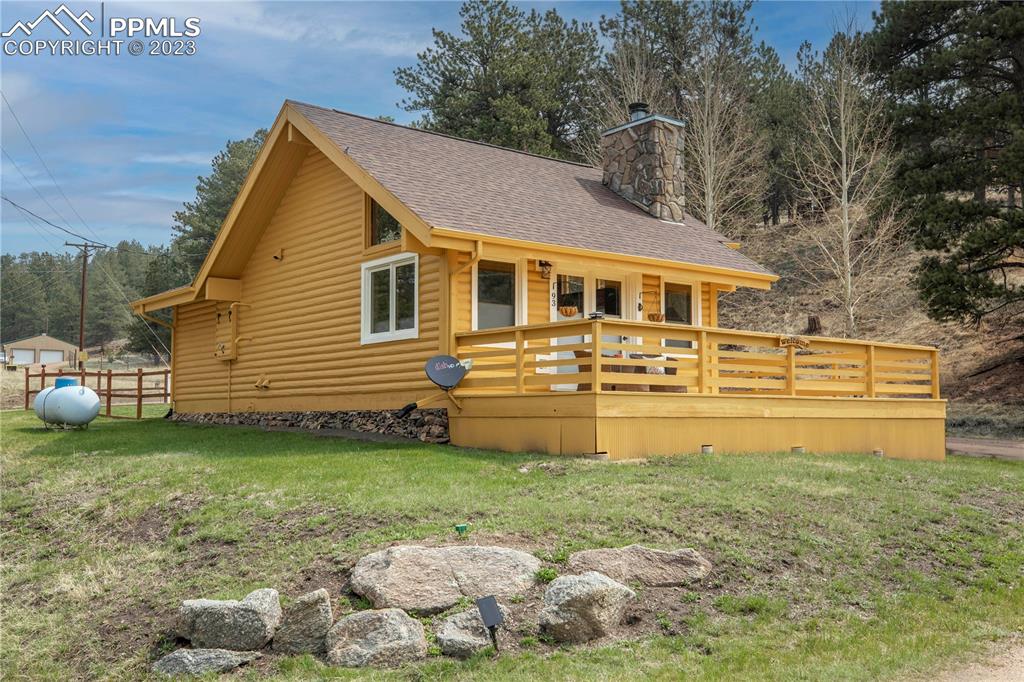 93 Water Street Guffey, CO 80820 - Photo 20 of 23 a view of a house with a yard