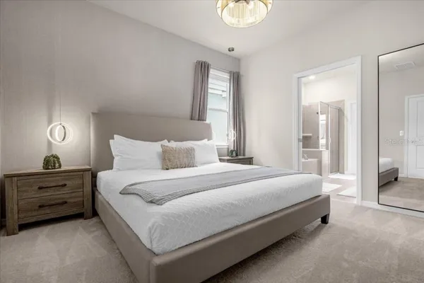 a bedroom with a bed and a dresser