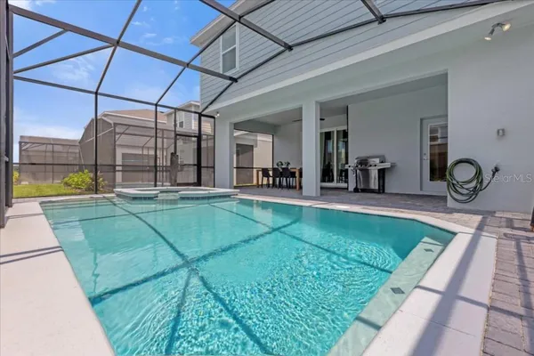 a view of a swimming pool with a patio