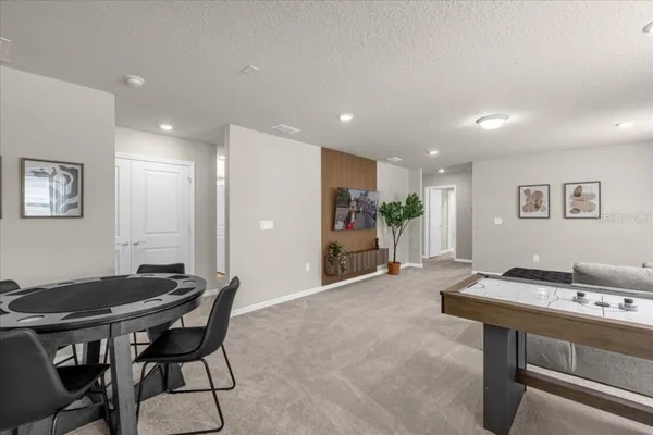 a bedroom with a bed and a night stand