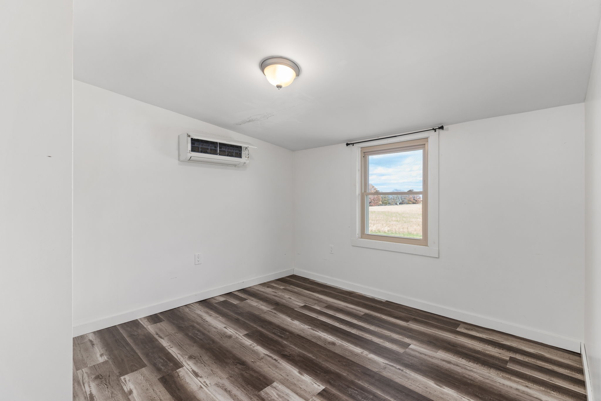9680 Buttermilk Ridge Road Lawrenceburg, TN 38464 - Photo 13 of 61 a view of a room with wooden floor and window
