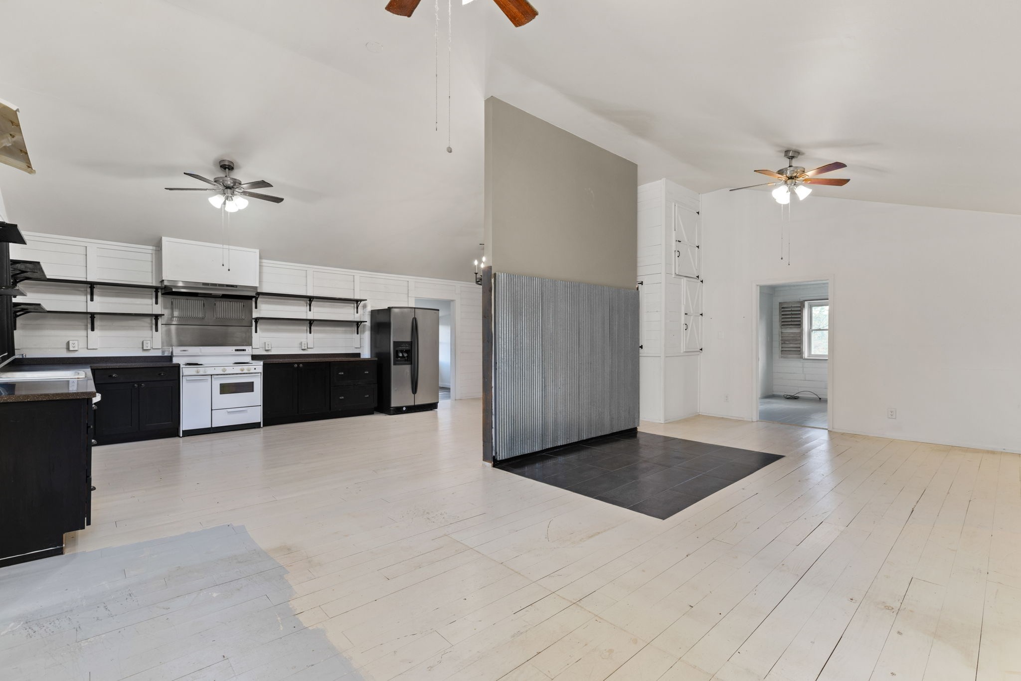 9680 Buttermilk Ridge Road Lawrenceburg, TN 38464 - Photo 22 of 61 a view of a kitchen with a sink and dishwasher a kitchen island with wooden cabinets