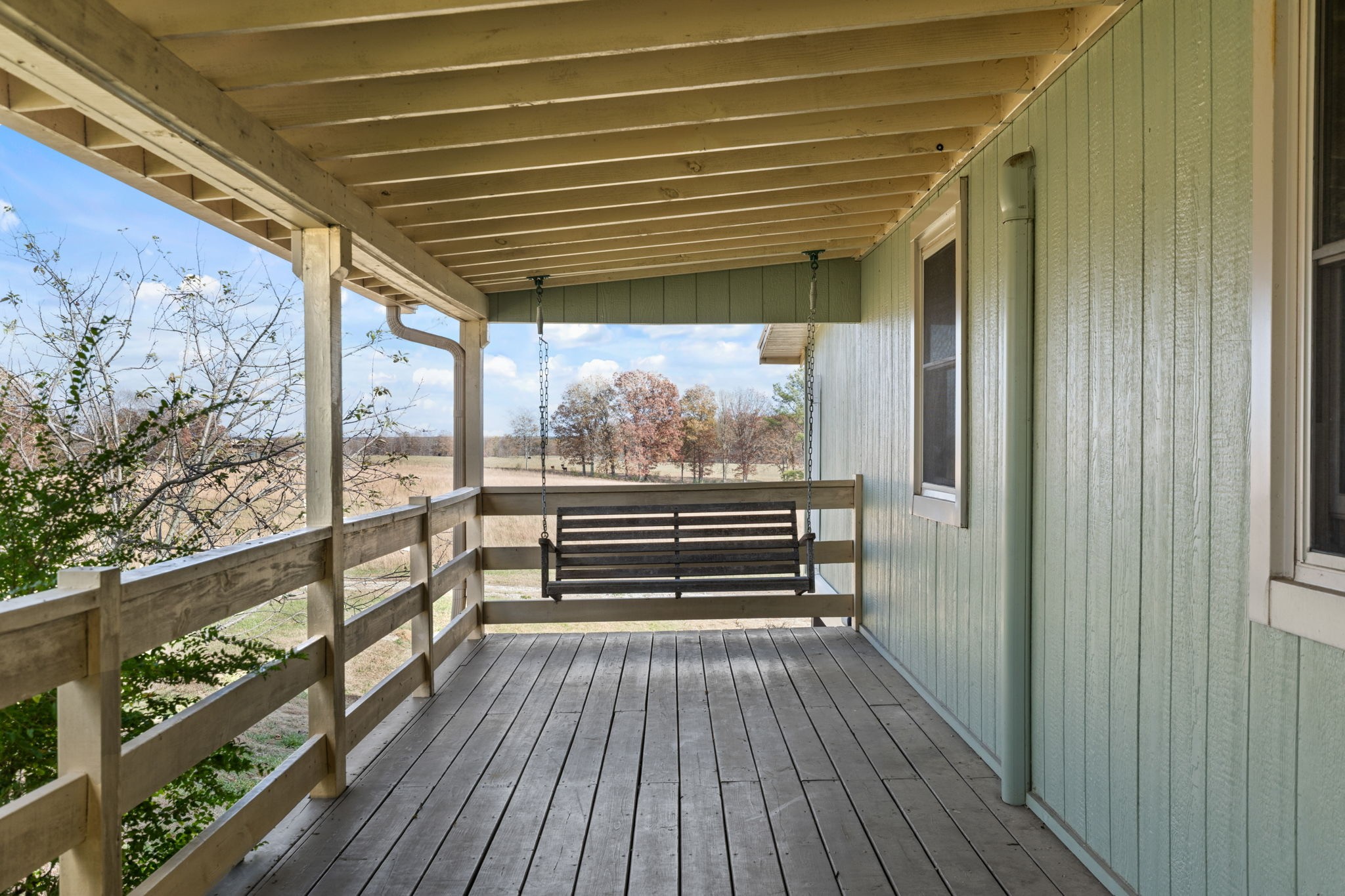 9680 Buttermilk Ridge Road Lawrenceburg, TN 38464 - Photo 30 of 61 a view of outdoor space with wooden floor and outdoor seating