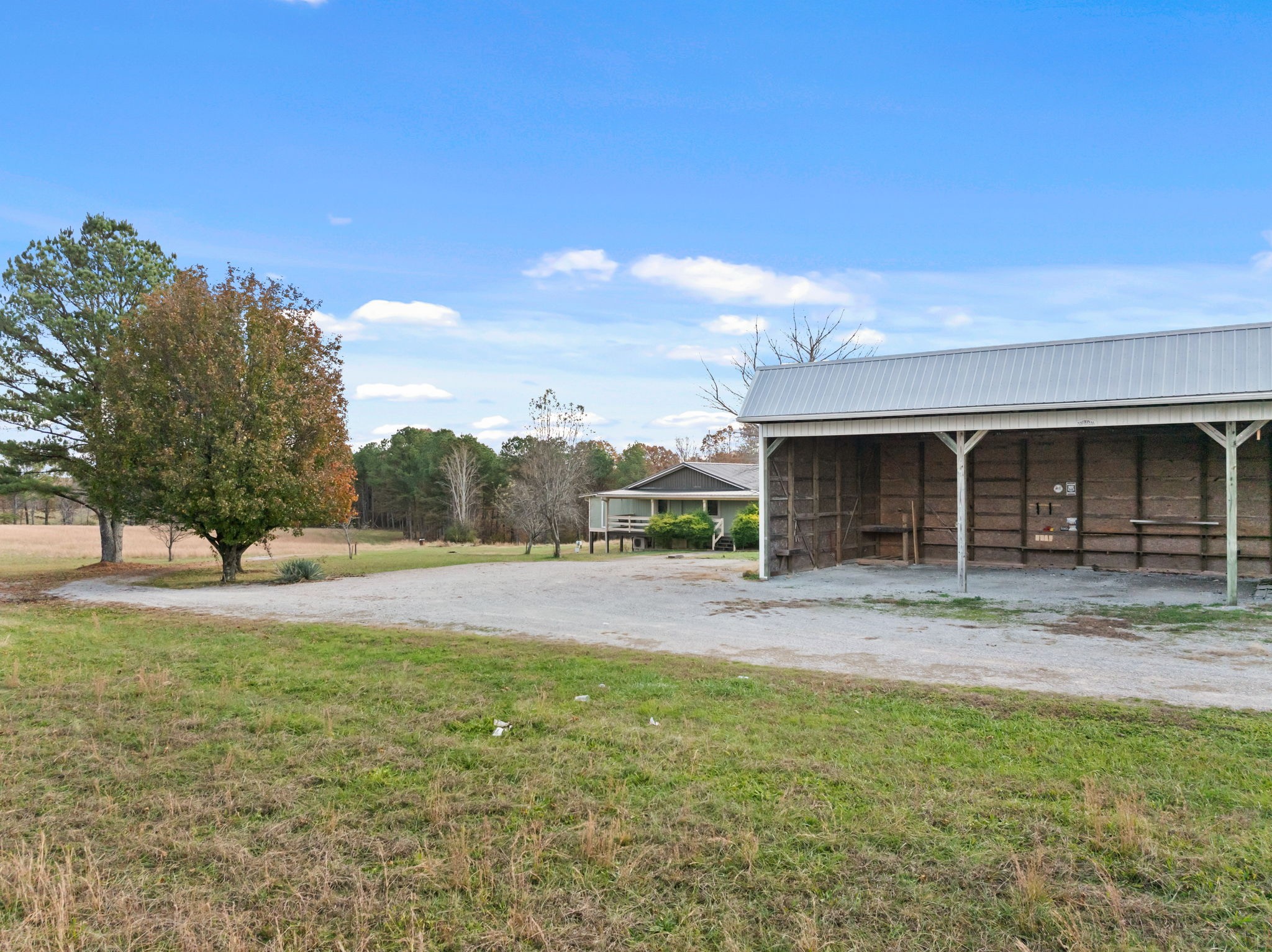 9680 Buttermilk Ridge Road Lawrenceburg, TN 38464 - Photo 33 of 61 a front view of a house with a yard and trees
