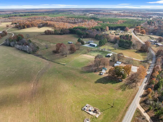 an aerial view of a houses with outdoor space