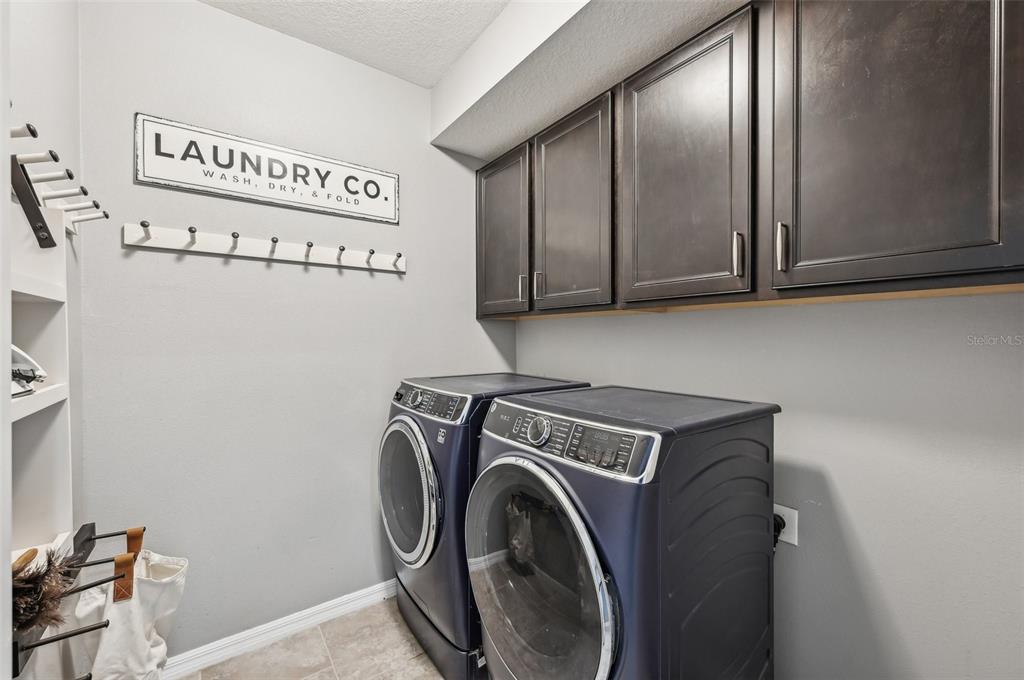 4515 Bent Tree Boulevard Sarasota, FL 34241 - Photo 11 of 34 a utility room with dryer and washer