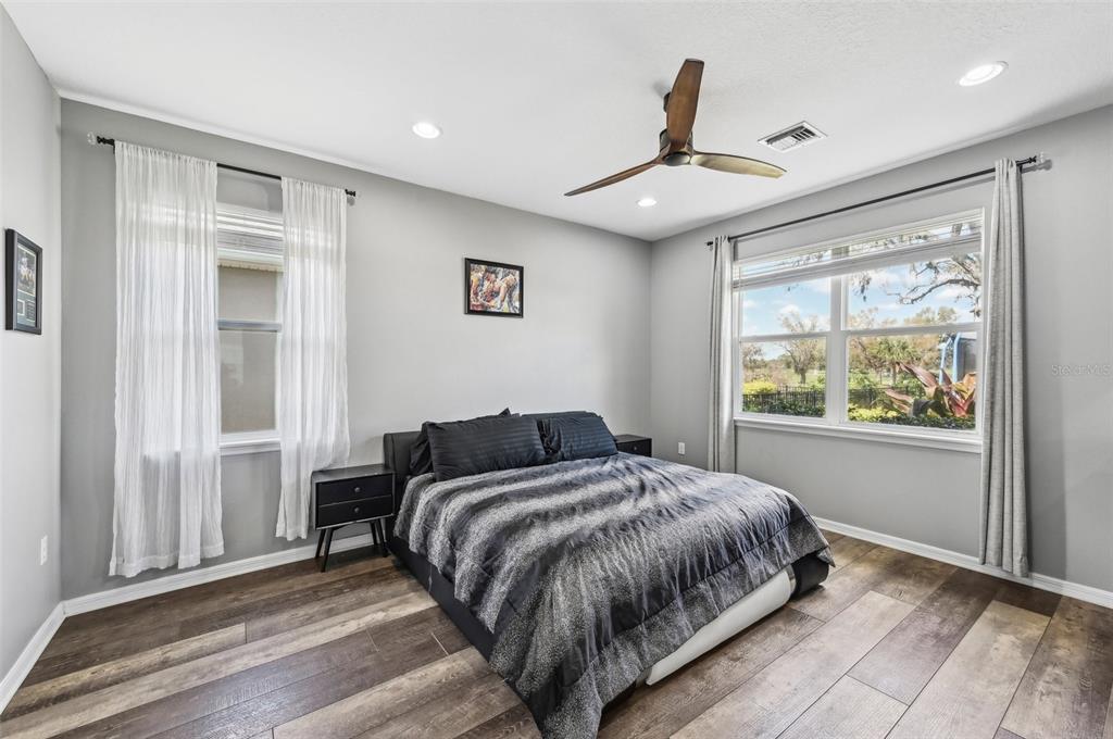 4515 Bent Tree Boulevard Sarasota, FL 34241 - Photo 13 of 34 a bedroom with a large bed and a window