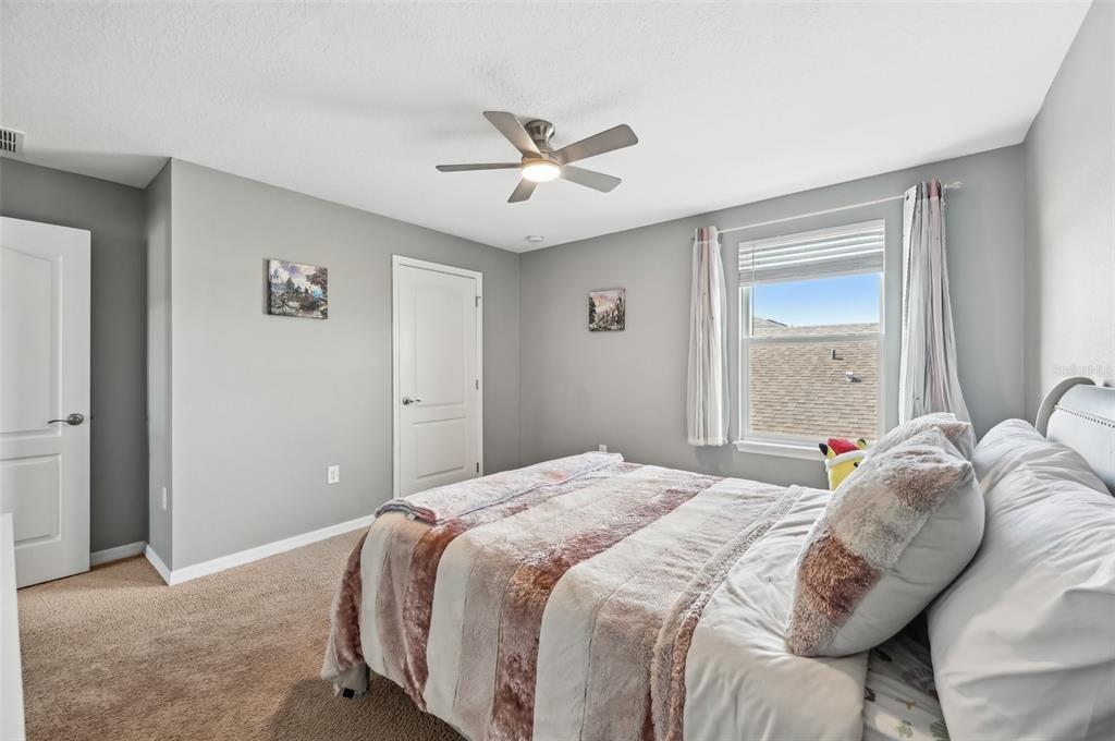 4515 Bent Tree Boulevard Sarasota, FL 34241 - Photo 18 of 34 a bedroom with a bed and a window