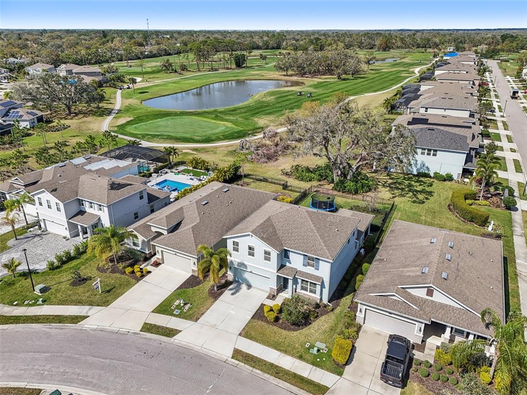4515 Bent Tree Boulevard Sarasota, FL 34241 - Photo 2 of 34 an aerial view of a house with garden space and ocean view