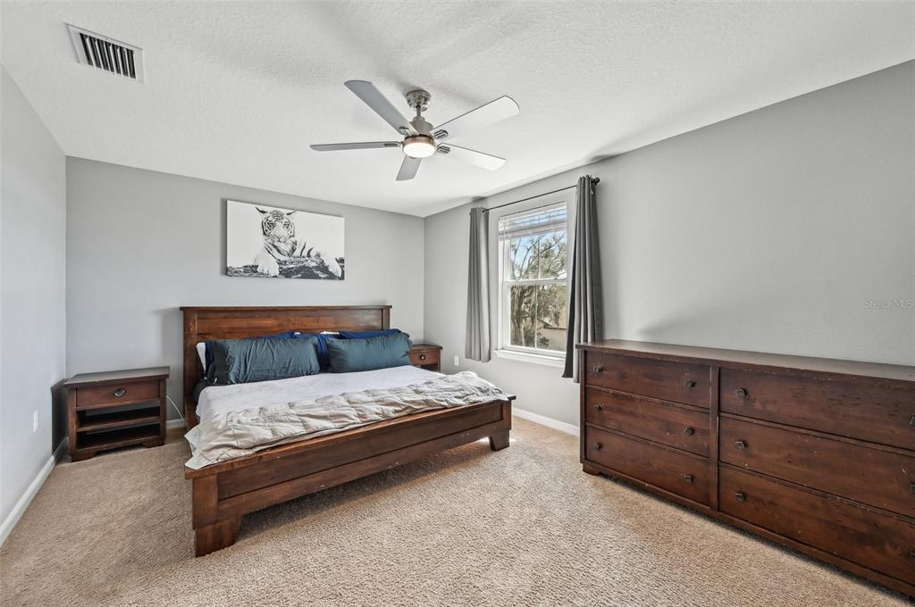 4515 Bent Tree Boulevard Sarasota, FL 34241 - Photo 21 of 34 a bedroom with a bed and window