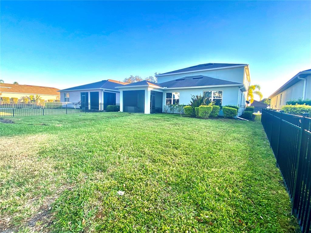 4515 Bent Tree Boulevard Sarasota, FL 34241 - Photo 26 of 34 a front view of a house with a yard