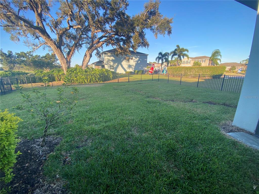 4515 Bent Tree Boulevard Sarasota, FL 34241 - Photo 27 of 34 a view of a field of grass and trees