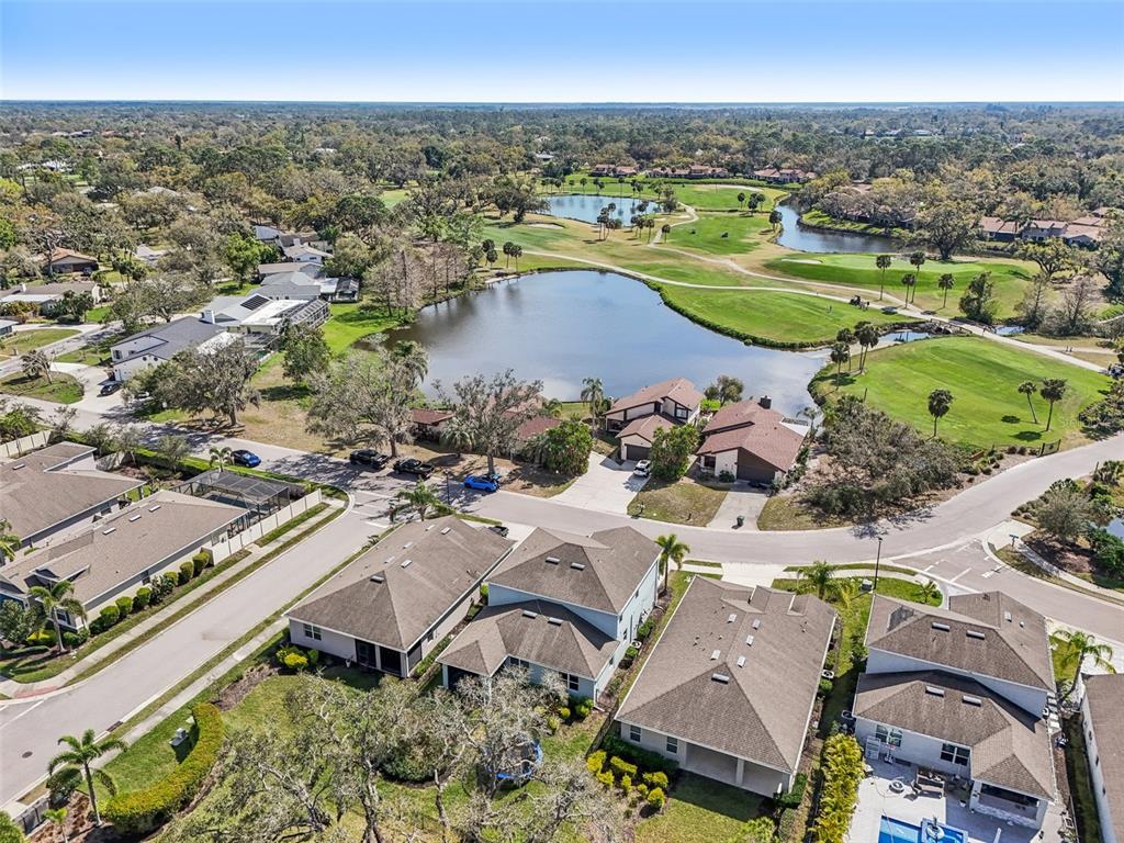 4515 Bent Tree Boulevard Sarasota, FL 34241 - Photo 29 of 34 an aerial view of a house with a swimming pool and outdoor seating