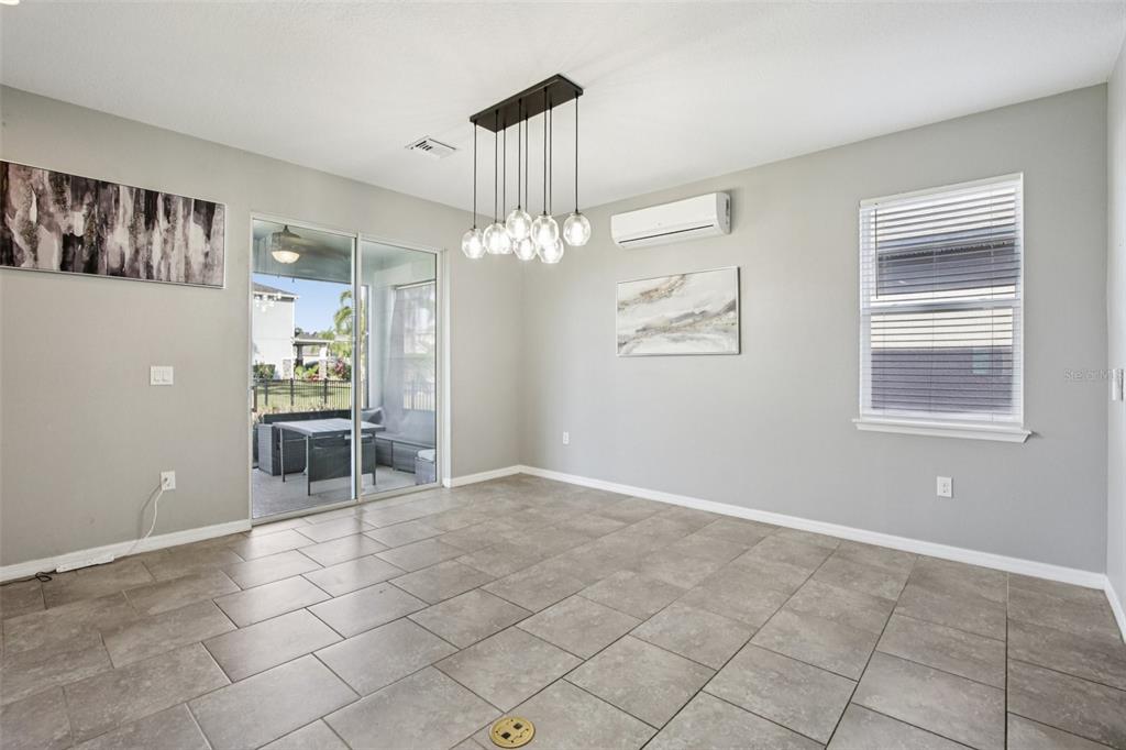 4515 Bent Tree Boulevard Sarasota, FL 34241 - Photo 6 of 34 a view of a livingroom with furniture and chandelier