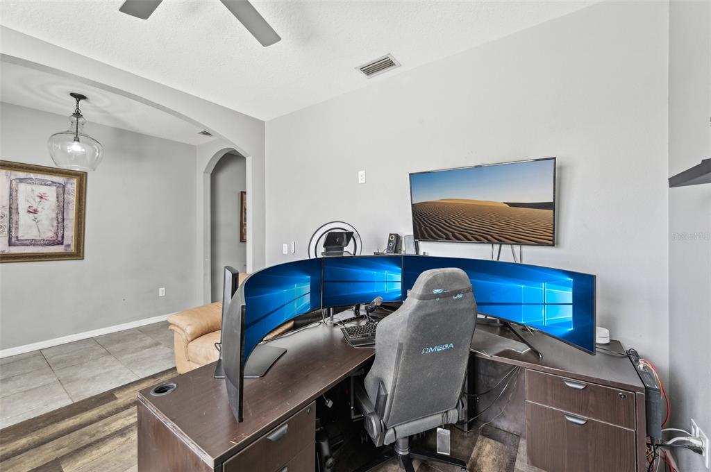 4515 Bent Tree Boulevard Sarasota, FL 34241 - Photo 10 of 34 a living room with furniture and a flat screen tv