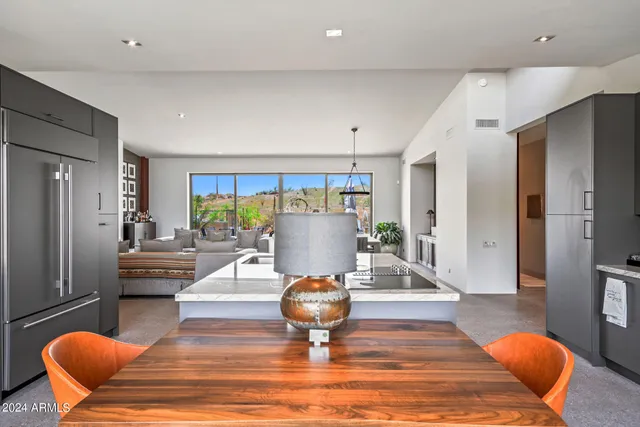 a bedroom with two large bed and a large window