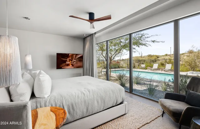 a bed room with a bed and a night stand