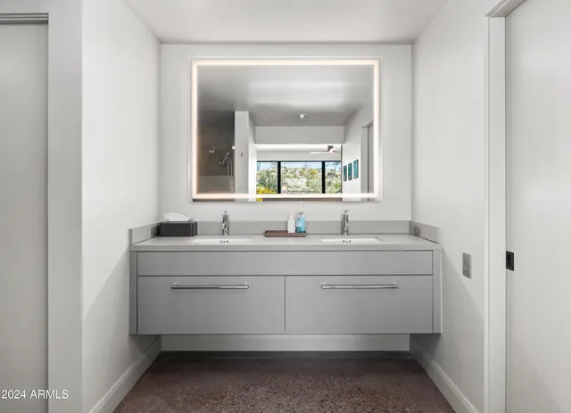 a bathroom with a sink and a mirror