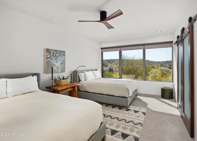 a bedroom with a bed and a couch