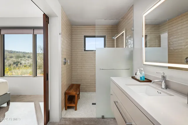 a bathroom with a sink and mirror