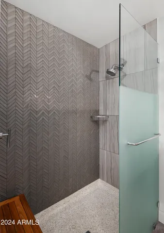 a view of swimming pool with outdoor seating and a lots of trees in the background