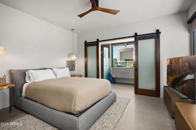 an aerial view of a house with swimming pool garden and patio