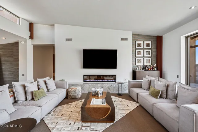 a dining hall with stainless steel appliances granite countertop a sink and dishwasher next to a large window