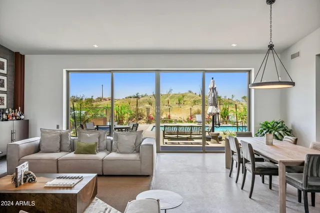 a view of a dining room with furniture and window