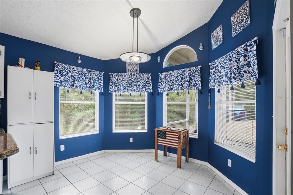 4219 Newton Road Spring Hill, FL 34606 - Photo 16 of 35 a view of an entryway with a chandelier