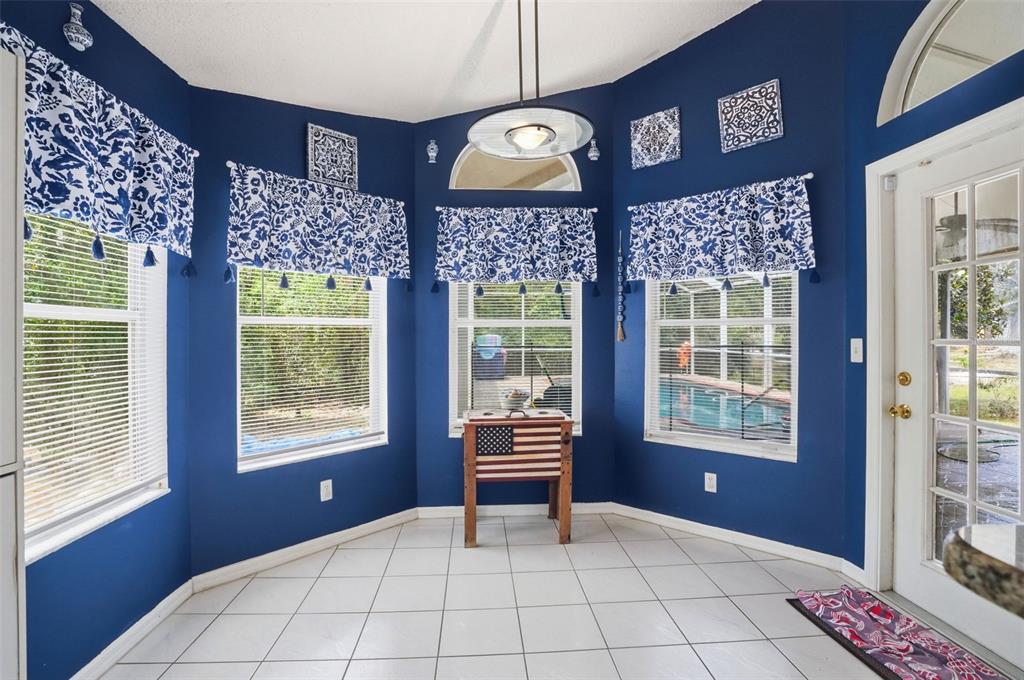 4219 Newton Road Spring Hill, FL 34606 - Photo 17 of 35 a bedroom with a bed and a window