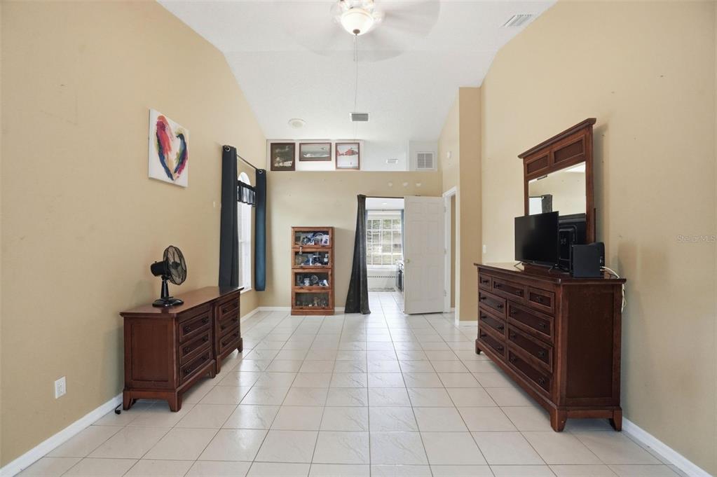 4219 Newton Road Spring Hill, FL 34606 - Photo 20 of 35 a living room with furniture and flat screen tv