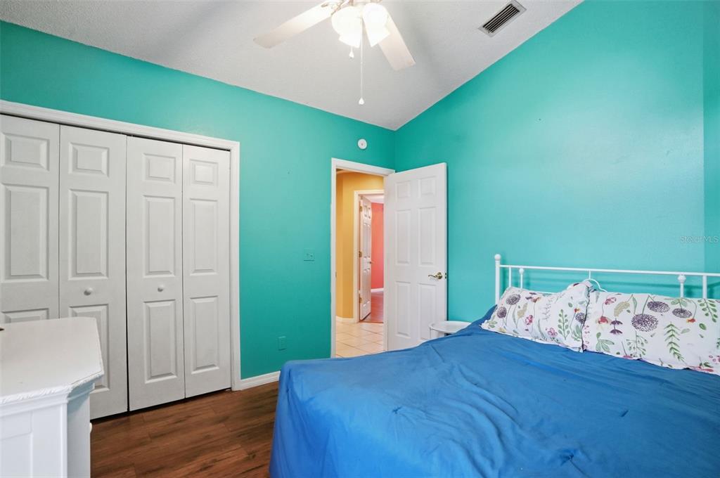 4219 Newton Road Spring Hill, FL 34606 - Photo 28 of 35 a view of a bedroom with wooden floor